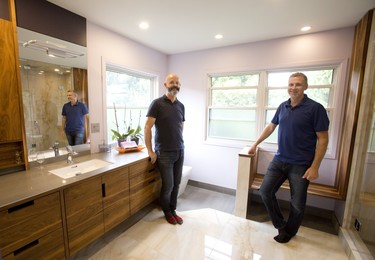 Chris Haindl of Cardinal cabinetry, left, and Brodie Watson of Bronco Construction Ltd. worked together to wow clients Dan and Wendy McCann at 23 Caithness Ct., part of the London Home Builders’ Association Parade of Renovations. Derek Ruttan/The London Free Press