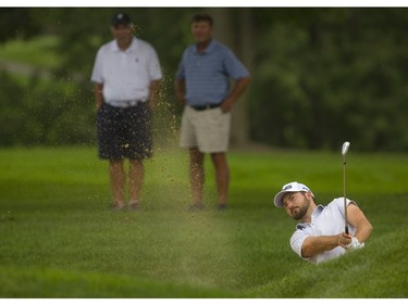 Zach Wright, the No. 2 player on the Mackenzie Tour, wedges the ball out of the fairway bunker on the 17th hole at the Highland Country Club during the first round of the Mackenzie Tour championship on Thursday Sept. 13.  Mike Hensen/The London Free Press