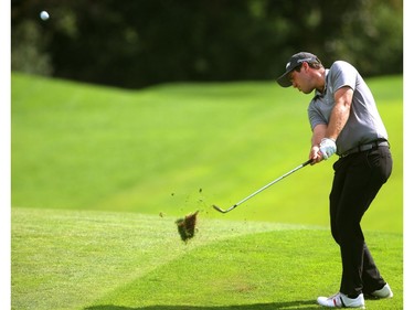 George Cunningham of Tuscon, Ariz., uses a lob wedge into the 18th hole during the second round of the Mackenzie Tour Championship at Highland Country Club in London Friday.  Cunningham finished at seven under after a bogey on 18th when he lipped out a putt from the fringe and then missed the comeback putt. (Mike Hensen/The London Free Press)