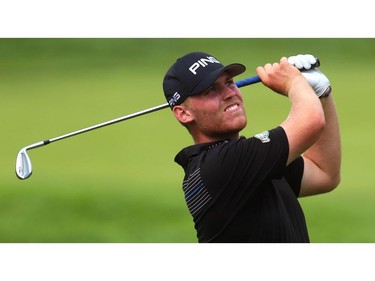 Ian Holt of Stow, Ohio, had to rip a 50-degree wedge to clear some trees on the 14th hole during the second round of the Mackenzie Tour Championshipat Highland Country Club in London. Friday.  Holt finished at eight under in a tie for fifth. (Mike Hensen/The London Free Press)