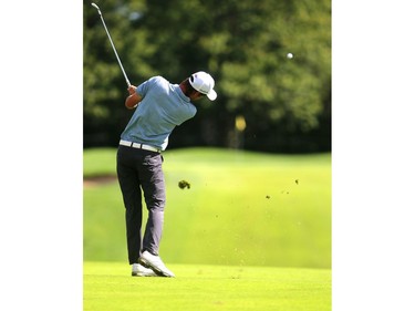 Corey Pereira hits his second shot on the dog-leg, par-four 16th hole at the Highland Country Club on Friday. (Mike Hensen/The London Free Press)