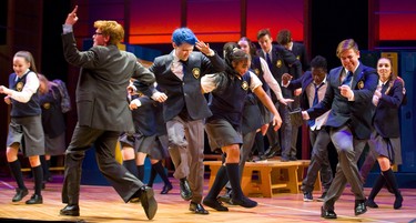 Bradley Amesse playing the lawyer Lonnie Wynn dances with Devon Dixon playing Marc Hall in Grand Theatre's High School Project production of Prom Queen: The Musical (Mike Hensen/The London Free Press)