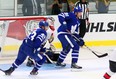 Toronto Maple Leafs centre John Tavares  and Nazem Kadri crowd Senators goalie Mike Condon during the Kraft Hockeyville game in Lucan against Ottawa on Tuesday Sept. 18, 2018.  Mike Hensen/The London Free Press