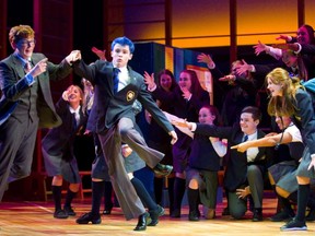 Bradley Amesse playing the lawyer Lonnie Wynn dances with Devon Dixon playing Marc Hall in Grand Theatre's High School Project production of Prom Queen: The Musical (Mike Hensen/The London Free Press)