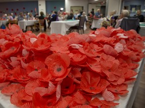 Veterans and volunteers created more than 4,000 paper poppies at Parkwood Hospital  in London, Ont. on Wednesday September 19, 2018. The poppies will be used in the Grand Theatres production of Timothy Findley's The Wars.   Derek Ruttan/The London Free Press/Postmedia Network