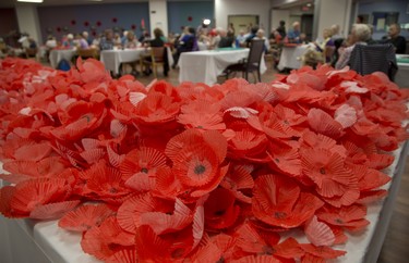 Veterans and volunteers created more than 4,000 paper poppies at Parkwood Hospital  in London, Ont. on Wednesday September 19, 2018. The poppies will be used in the Grand Theatres production of Timothy Findley's The Wars.  (Derek Ruttan/The London Free Press)