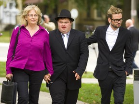 Andrea Silcox, with her sons Evan, left, and Adam leave the public inquiry hearing in St. Thomas into long-term care in the wake of Elizabeth Wettlaufer's murders. Wettlauffer, a nurse, killed Andrea Silcox's father James. (Mike Hensen/The London Free Press)