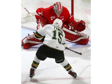 Cole Tymkin of the London Knights goes five hole on Soo Greyhounds' goaltender Matthew Villalta to tie the score at 1-1 in the first period of their game at Budweiser Gardens Friday Sept. 28.  Mike Hensen/The London Free Press