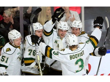 Cole Tymkin of the London Knights  celebrates with teammates Matthew Timms, left, Billy Moskal, Adam Boqvist and Josh Nelson after he scored to tie the game at 1-1 in the first period of their game at Budweiser Gardens  Friday Sept. 28, 2018.  Mike Hensen/The London Free Press