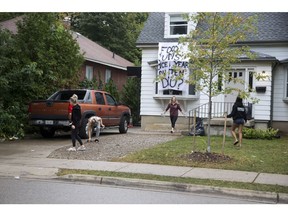 Residents clean up their  Broughdale Avenue residence the day after a large "fake homecoming" street party in London, Ont. on Sunday September 30, 2018. Derek Ruttan/The London Free Press/Postmedia Network