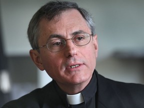 In this May 30, 2011, file photo, Rev. Ronald Fabbro, Bishop of the Roman Catholic Diocese of London, speaks to the Windsor Star on priests implicated in sexual misconduct throughout the organization.