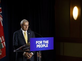 Ontario Finance Minister Vic Fedeli pauses during a press conference after addressing the Economic Club of Canada in Toronto on Friday about the provincial deficit and debt.