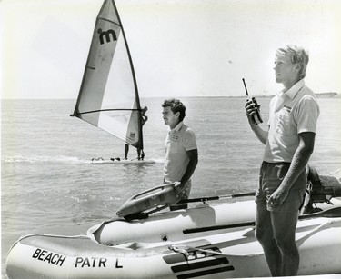 Port Stanley beach patrol members Justin Whittaker of St. Thomas, left and Gord Low of London watch swimmers, 1986. (London Free Press files)