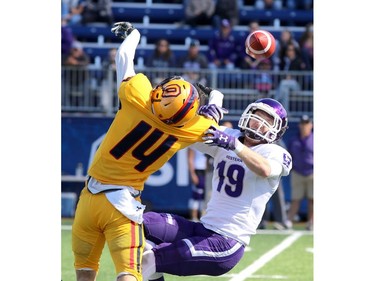 Queen's Golden Gaels Cory Blake breaks up a pass to Western MustangsHarry McMaster during their Ontario University Athletics football game in Kingston Saturday Sept. 9 2018. Western won 26-23.   Ian MacAlpine/Postmedia Network