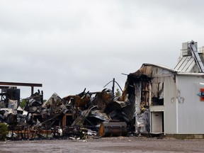 Firefighters continue to monitor hot spots Monday after an early morning fire destroyed the J. H. Keeso and Sons Ltd. sawmill on the outskirts of Listowel.