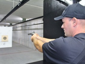 Jay Hutchison aims a gun at The Shooting Academy on Tuesday September 18, 2018 in Listowel, Ont. Terry Bridge/Stratford Beacon Herald/Postmedia Network