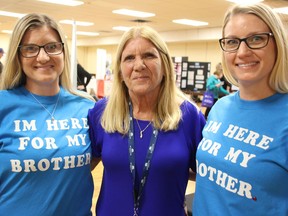 Laurie Hicks stands with her daughters Brienne, 35, left, and Amanda, 32, Saturday at an event showcasing community services for addictions and mental health in Sarnia. They're advocates for creating a 24-bed withdrawal management hub in the community. Tyler Kula/Sarnia Observer/Postmedia Network