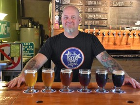 Brian Connatser, owner-brewer at Sleepy Owl Brewing, shows off a flight of American Blonde, Sirona Imperial IPA, Bays Mountain Amber, Down on My Luck Imperial Red, and Aggressive Tread Black Ale.  (Wayne Newton/Special to Postmedia News)