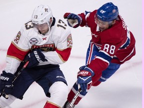 Montreal Canadiens' Nick Suzuki tries to get to Florida Panthers' Mark Pysyk during first period NHL hockey action Wednesday, September 19, 2018 in Montreal. THE CANADIAN PRESS/Paul Chiasson