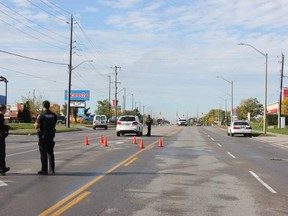 London police officers investigate a collision Saturday involving a pedestrian and a vehicle on Highbury Avenue north of Cheapsie Street. JONATHAN JUHA/THE LONDON FREE PRESS