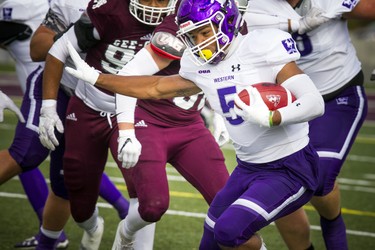 The Western Mustangs were in Ottawa to play the uOttawa Gee-Gees Saturday October 13, 2018 at the Gee-Gees Field. Mustangs #5 Alex Taylor gets the ball away from the Gee-Gees Saturday afternoon.   Ashley Fraser/Postmedia