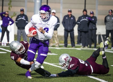 The Western Mustangs were in Ottawa to play the uOttawa Gee-Gees Saturday October 13, 2018 at the Gee-Gees Field. Mustangs #12 Chris Merchant gets the ball away from the Gee-Gees Saturday afternoon.   Ashley Fraser/Postmedia