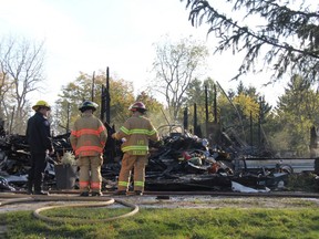 Members of the London fire department were Monday at the scene of a fire that completely destroyed a century-old home in Lambeth Sunday night. JONATHAN JUHA/THE LONDON FREE PRESS