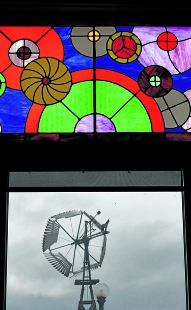 An historical windmill located on the grounds of the American Wind Power Centre in Lubbock is viewed from a window adorned with a modern stained-glass depiction of the whirling wonders.

BARBARA TAYLOR/THE LONDON FREE PRESS
Lubbock, Texas