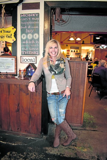 Teresa Stephens, owner of Cast Iron Grill, Lubbock advises, "You have to love what you do to thrive." Certainly the hearty food served reflects this philosophy, especially the restaurant's signature pies, also available as take out. Witness the sign.

BARBARA TAYLOR/THE LONDON FREE PRESS
Lubbock, Texas