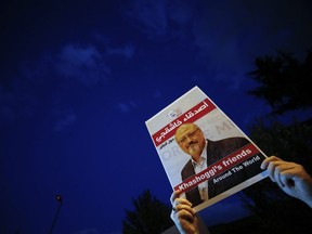 Activists protesting the killing of Saudi journalist Jamal Khashoggi hold a candlelight vigil outside Saudi Arabia's consulate in Istanbul. (Emrah Gurel/AP Photo)