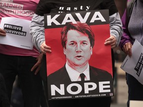 Activists and advocates for survivors of sexual abuse gather in the Federal Building Plaza to protest the confirmation of Supreme Court nominee Brett Kavanaugh on September 28, 2018 in Chicago, Illinois.