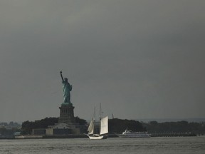 The Statue of Liberty stands in New York Harbor on October 9, 2018 in New York City. In a new United Nations report, climate scientists are urging people and global governments to take urgent action to keep global warming from exceeding 1.5C. The report predicts that hot extremes, heavy rains, droughts, wildfires and extreme flooding will increase as global temperatures continue to rise. A report released last year found that water surrounding New York City climbed 1.5 times faster than the global average.  (Photo by Spencer Platt/Getty Images)