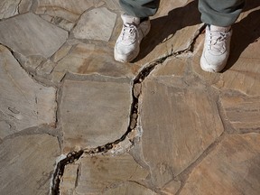 Driveway and sidewalk cracks are best repaired before the deep freeze of winter arrives. (Getty Images)