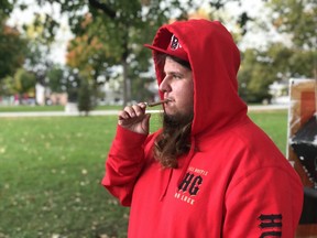 A London man, who only identified himself as Sonny, lights up a joint Wednesday morning at Victoria Park. He said it was about time cannabis had become legal in Canada. JONATHAN JUHA/THE LONDON FREE PRESS