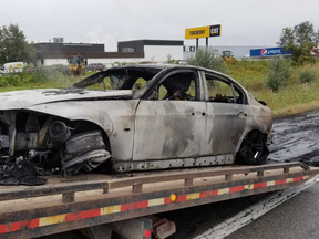 The OPP are investigating a vehicle fire on the eastbound lane of Highway 401, near Highbury Avenue, on Wednesday morning as a possible arson. A London man has been arrested. (OPP supplied photo)