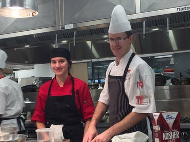 Chef instructor John Synesael, with culinary management apprentice Aimee Ryan, works in the kitchen at Fanshawe's downtown restaurant, The Chef's Table. (HEATHER RIVERS/THE LONDON FREE PRESS)