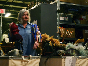The Stratford Festival’s head of props, Dona Hrabluk, sorts through some of the items that will be available at this weekend’s festival warehouse sale. Do you recognize anything? (Galen Simmons/The Beacon Herald)