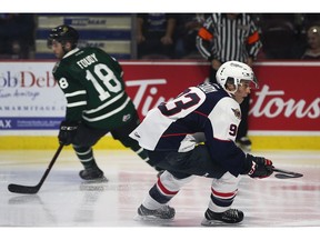 Brothers Liam Foudy, left, of the London Knights and Jean-Luc Foudy of the Windsor Spitfires are shown during Thursday's game at the WFCU Centre.