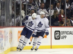 Toronto Maple Leafs' Nazem Kadri (43) gives a fist pump as he celebrates long-awaited first goal of the season with lineamte Par Lindholm during second period NHL hockey action against the Winnipeg Jets in Winnipeg, Wednesday, October 24, 2018. THE CANADIAN PRESS/Trevor Hagan