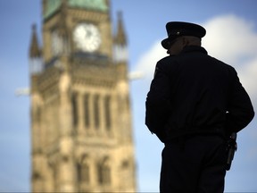 A House of Commons security guard is photographed on Parliament Hill Tuesday October 20, 2015. (Darren Brown/Ottawa Citizen)