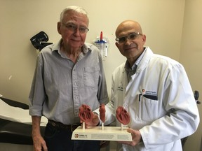 Cardiac patient James Fuller, 78, and London Health Sciences Centre cardiac surgery chief Dr. Bob Kiaii are celebrating a world first in cardiac surgery using robots. In June, Fuller became the first patient to receive a tissue valve placed by da Vinci robot  to replaces his calcified aortic valve. (Jennifer Bieman/The London Free Press)