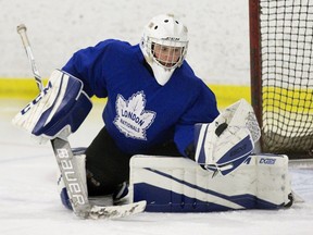 London Nationals netminder Zach Springer makes a glove save during practice at the  Wester Fair Sports Centre in London. Derek Ruttan/The London Free Press/Postmedia Network
