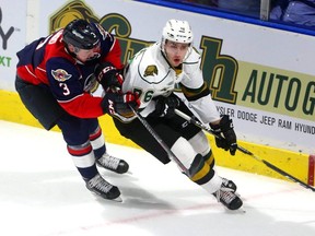 Billy Moskal of the Knight carries the puck behind the Spitfires' net. (Mike Hensen/The London Free Press file photo)