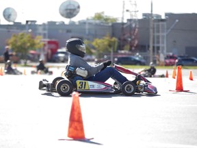 More than 100 people participated in a distracted driving exercise in a Western Fair parking lot in London. on Thursday. Participants  were tested on go-carts to show how even a momentary distraction can be devastating.  (Derek Ruttan/The London Free Press)