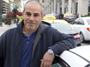 London cab driver Mohammad Osman worries if the city stops regulating taxi fares it will result in less money for drivers. (Derek Ruttan/The London Free Press)