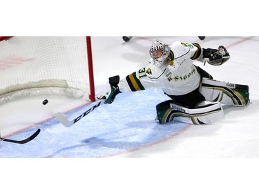 London Knights goalie Jordan Kooy dives too late for the shot from Owen Sound's Aiden Dudas during a powerplay during their game at Budweiser Gardens on Friday Oct. 5, 2018. The short-handed goal was the only one scored in the first period. (Mike Hensen/The London Free Press)