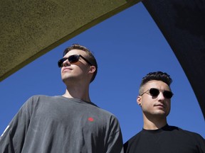 Andrew Fedyk, left, and Joe Depace, better known as the electronic dance music duo Loud Luxury, pause during Wednesday’s Juno awards promo video shoot in Springbank Park. (DEREK RUTTAN/THE LONDON FREE PRESS)