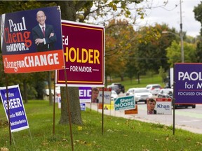 Election signs at the intersection of Riverside Avenue and Wonderland Road in London. (MIKE HENSEN, The London Free Press)