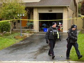 London police canvass the neighbourhood Monday, Oct. 15 after a morning fire at 82 Fairlane Cres. in Byron. No one was hurt in the blaze that occurred about 8:30 a.m. Monday. Deemed suspicious, the Ontario Fire Marshall has been called in to investigate .  Mike Hensen/The London Free Press