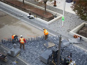 Flex Street construction continues as bricks are laid on Dundas Street between Talbot and Ridout streets Friday Oct. 19, 2018. Stage one of the project is expected to be completed in early December. (Derek Ruttan/The London Free Press)